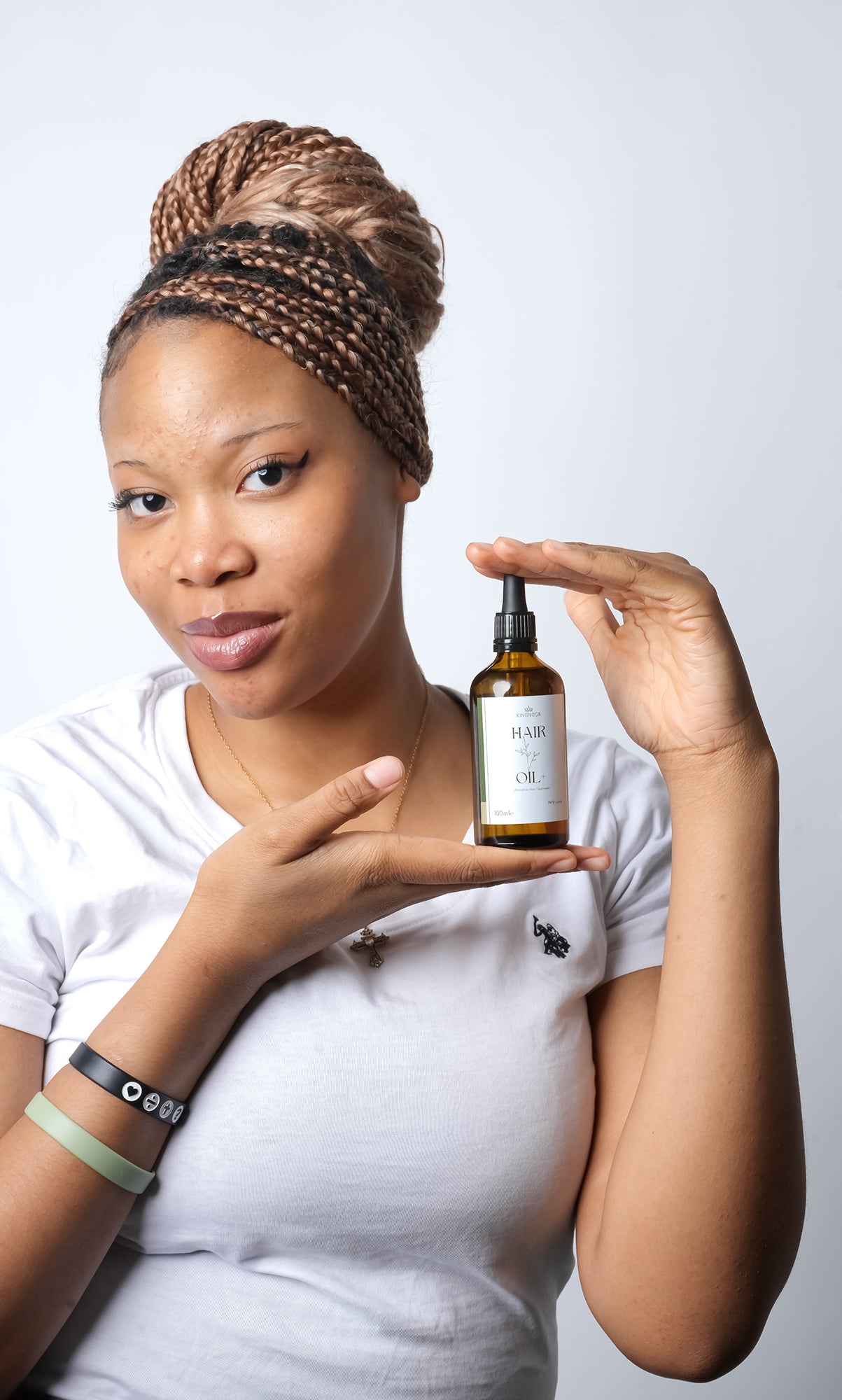 applying natural hair oil to scalp