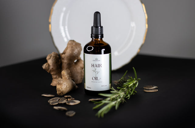 applying natural hair oil to scalp